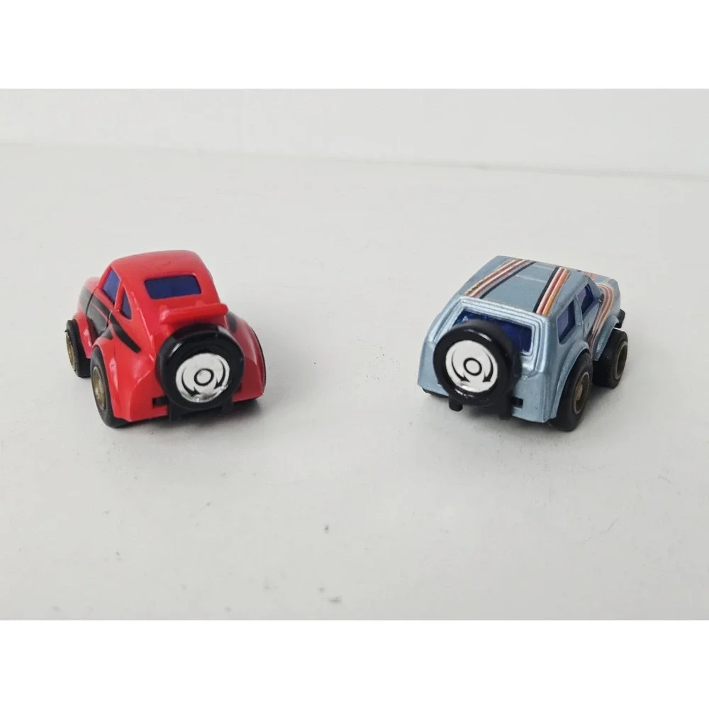 Vintage MC Toy pull back race car pair